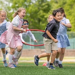 Lower School students playing on the turf field