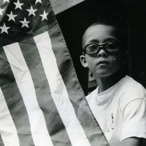 A photo of a boy with the american flag