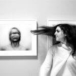 A girl in an art gallery with extreme movement
