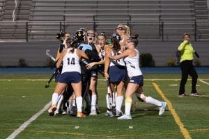 field hockey team celebrates after tournament of champions victory