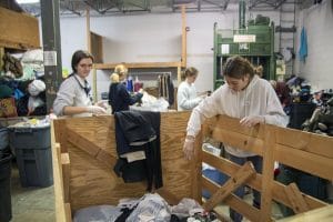 Students sort through donated clothing