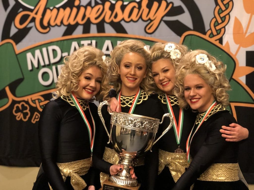 Oak Knoll juniors Mary Kate Vowells ’21 and Madeline Morton ’21 with their first place trophy in an irish dance competition.