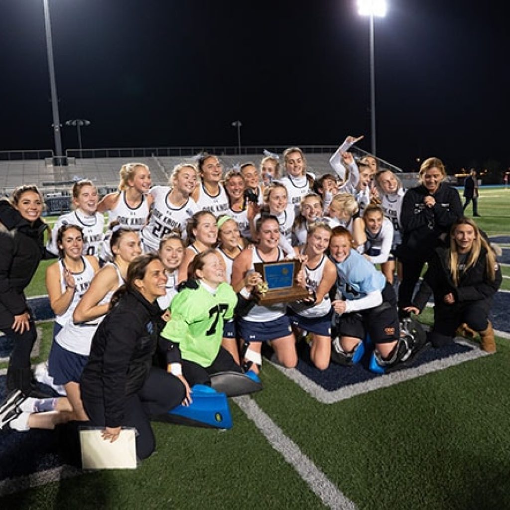 Oak Knoll field hockey celebrates tournament of champions victory in fall 2019.