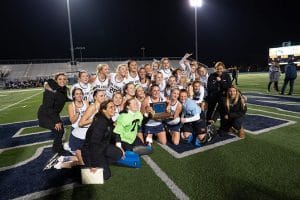 Oak Knoll field hockey celebrates tournament of champions victory in fall 2019.