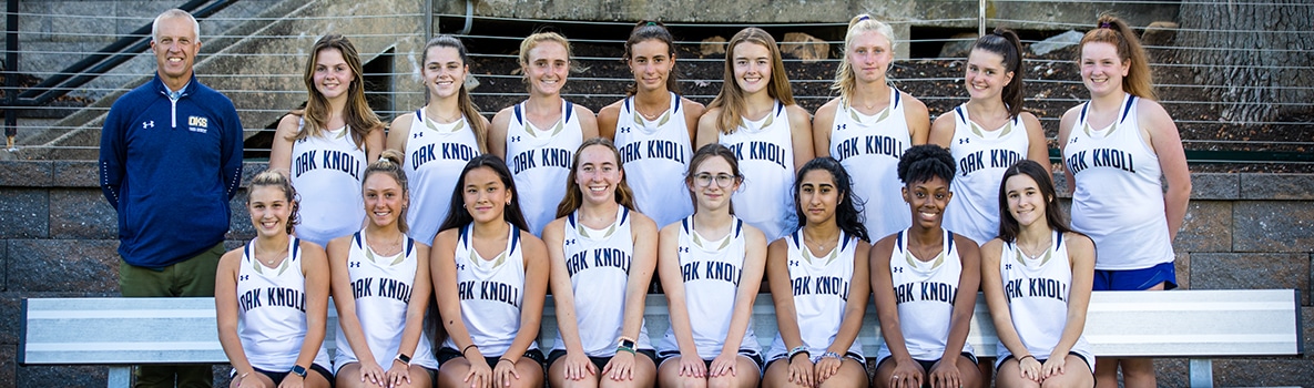 Team photo of varsity cross country team in two rows.