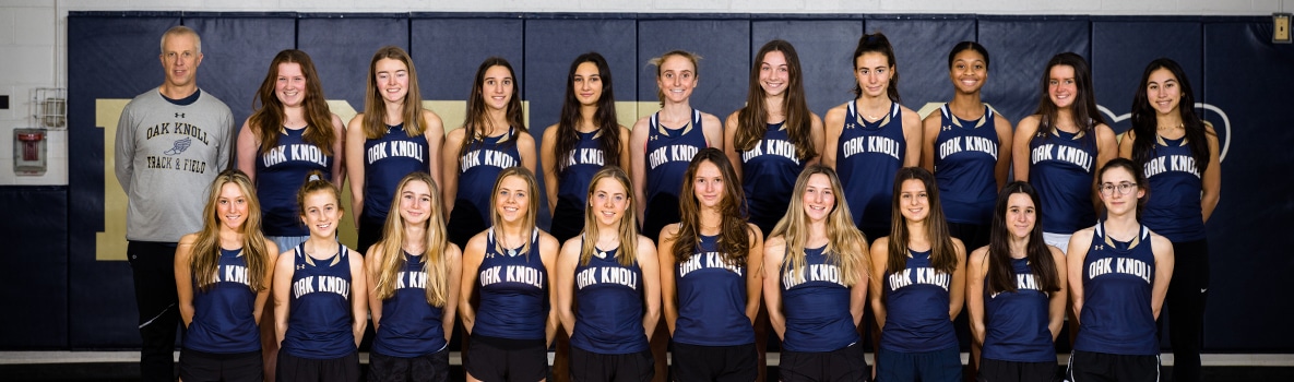 Team photo of varsity winter track team in two rows.